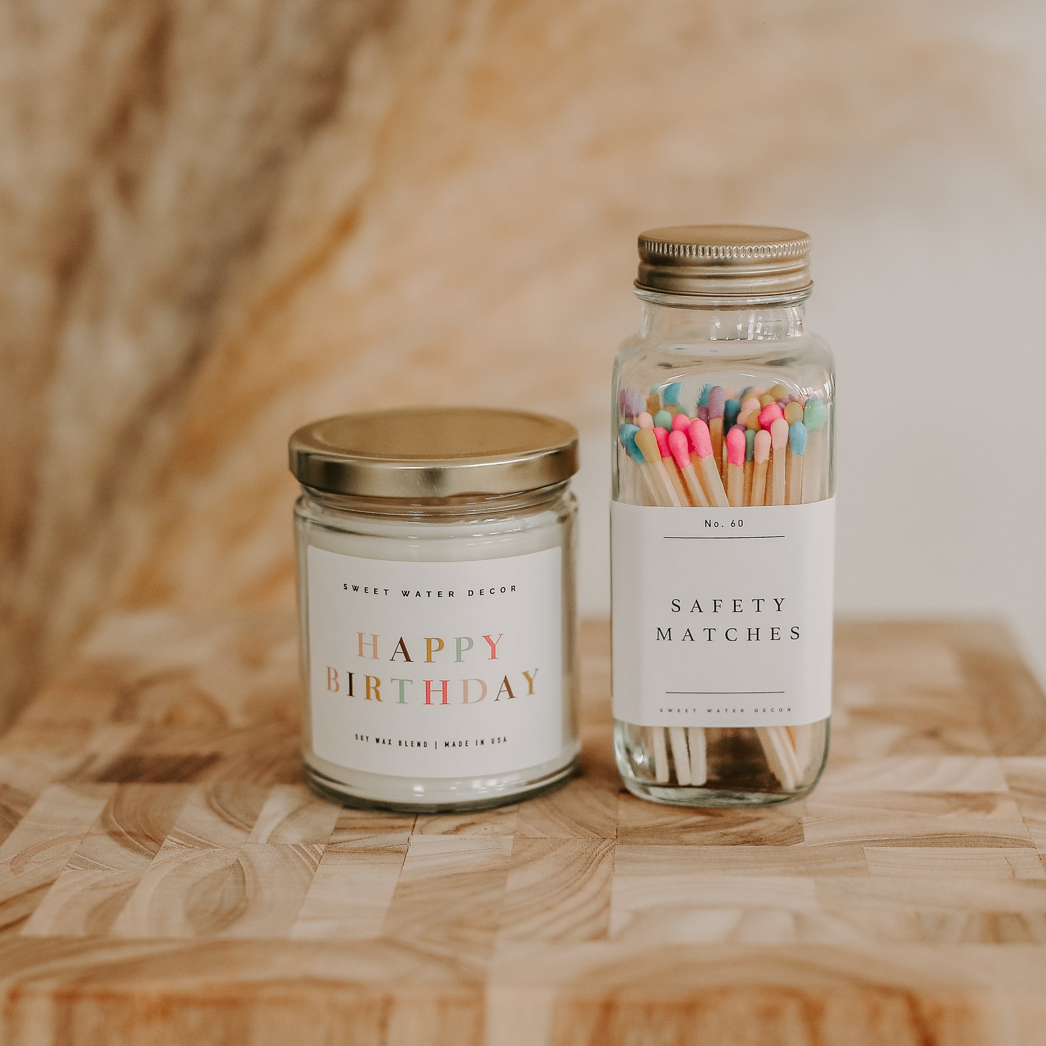 Decorative safety matches with strike pad on glass