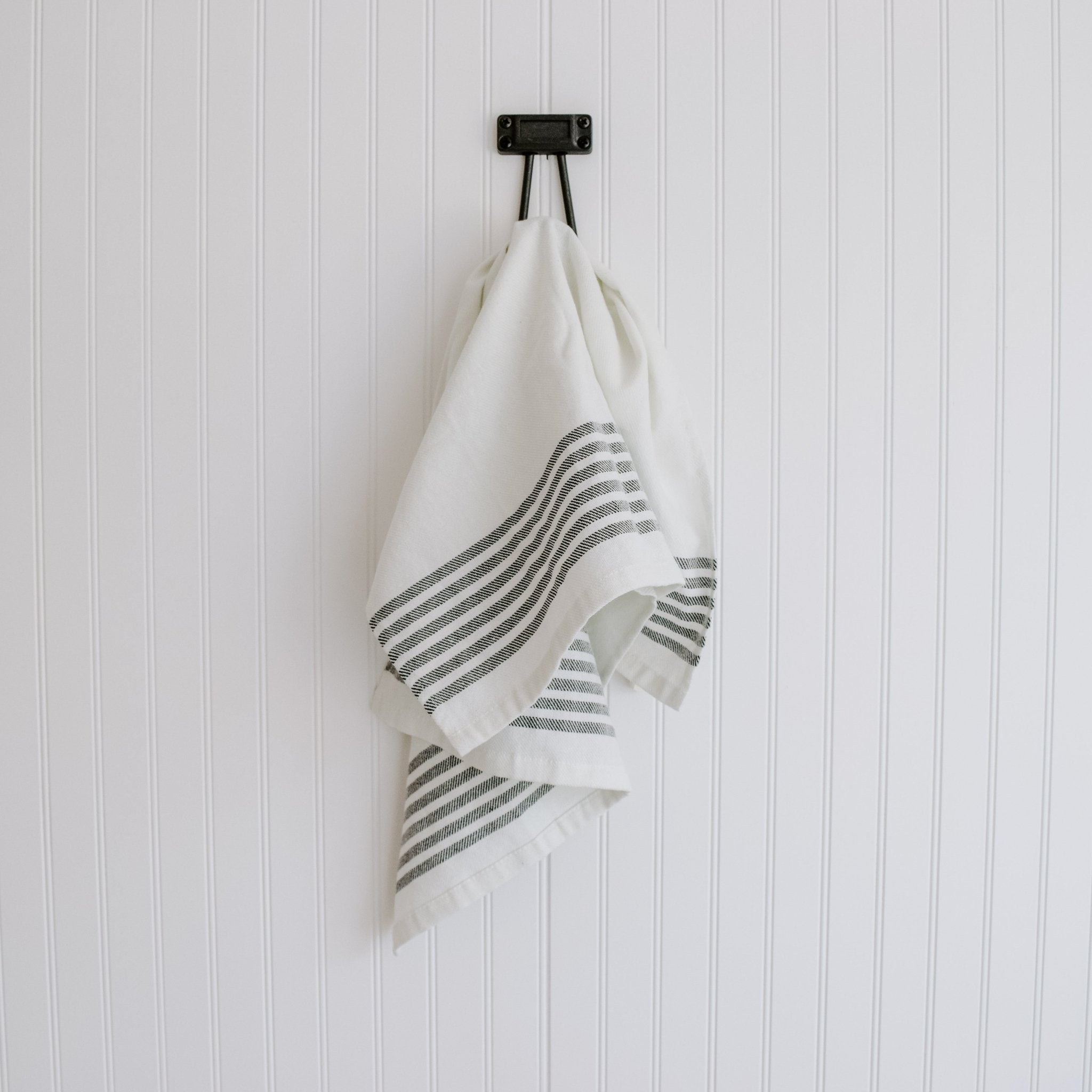 Striped tea towel folded neatly on kitchen counter