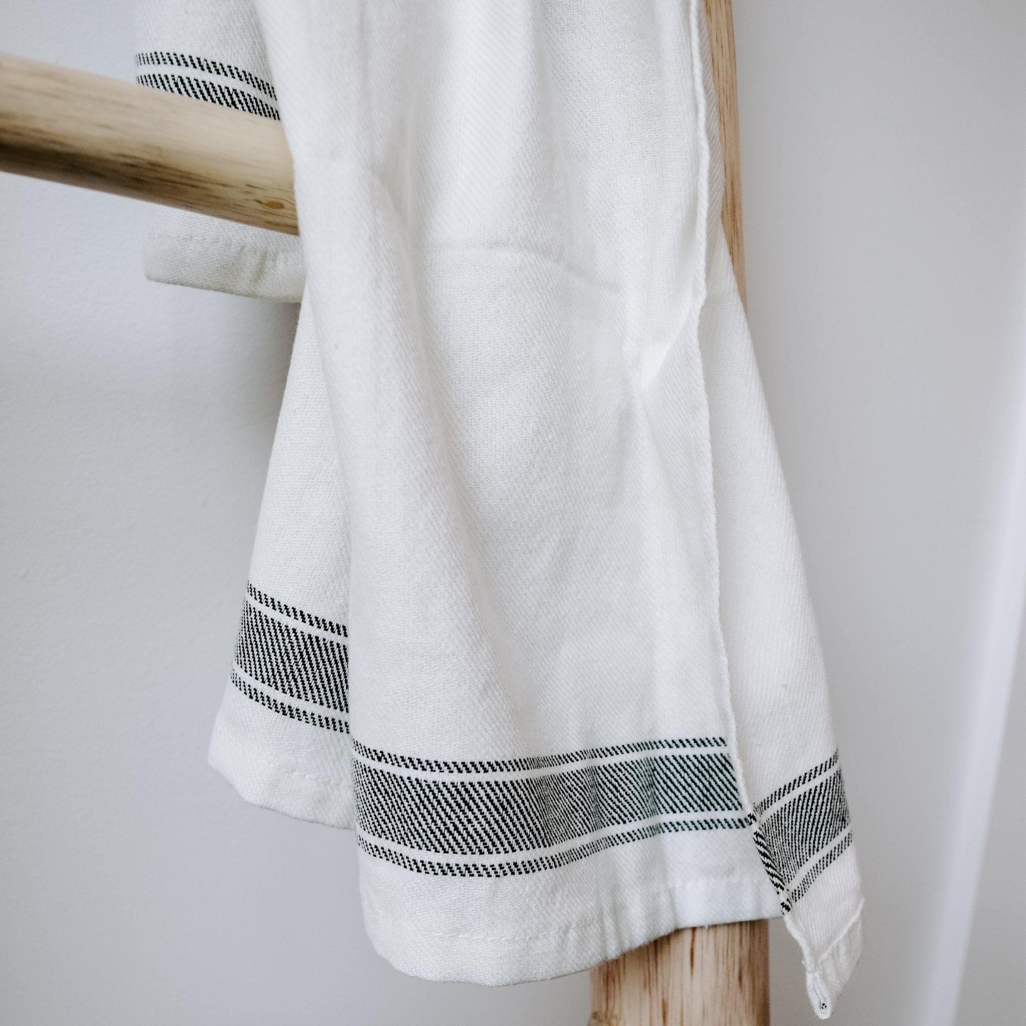 Sweet Water Decor striped tea towel styled in rustic kitchen