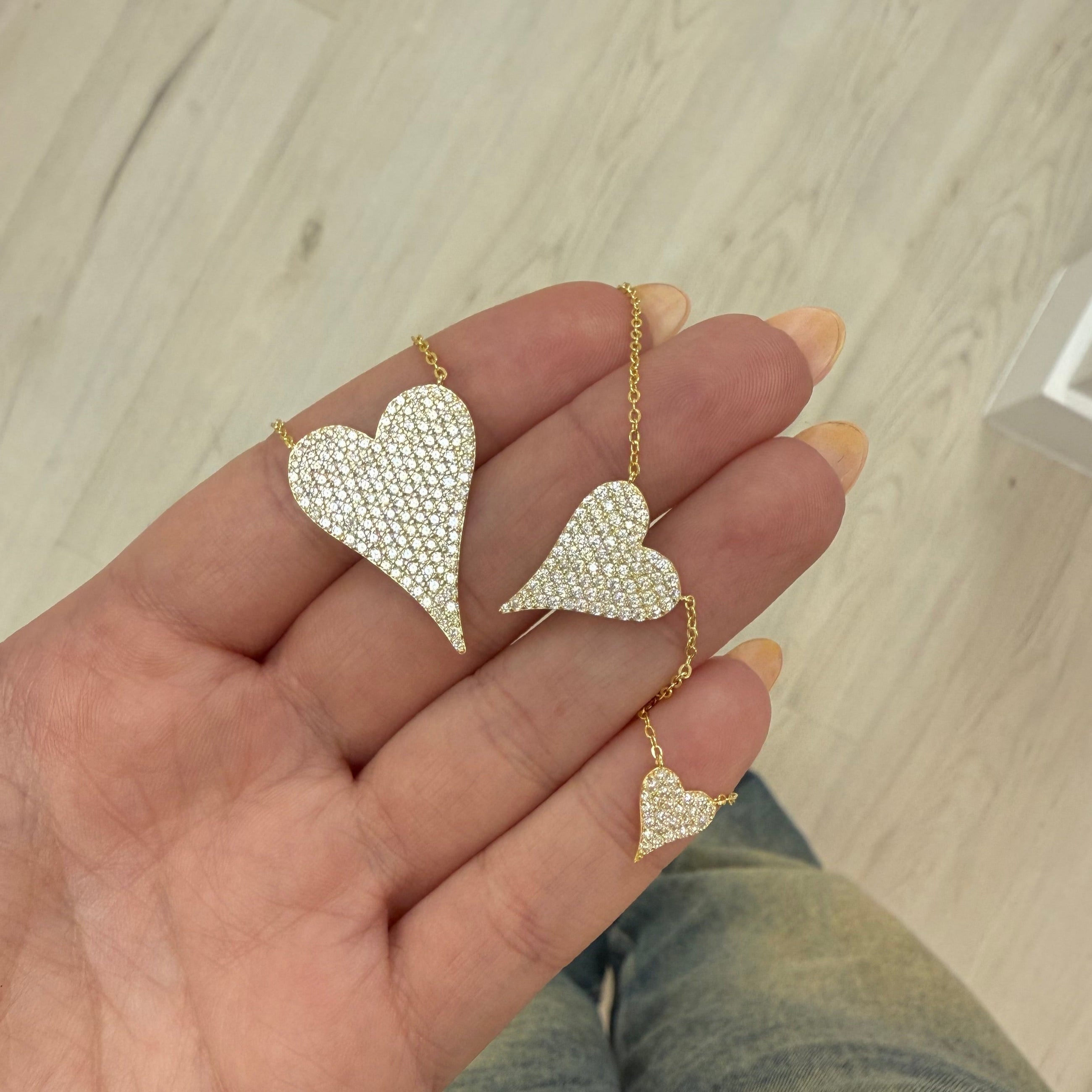 Gold heart pendant necklace styled on model