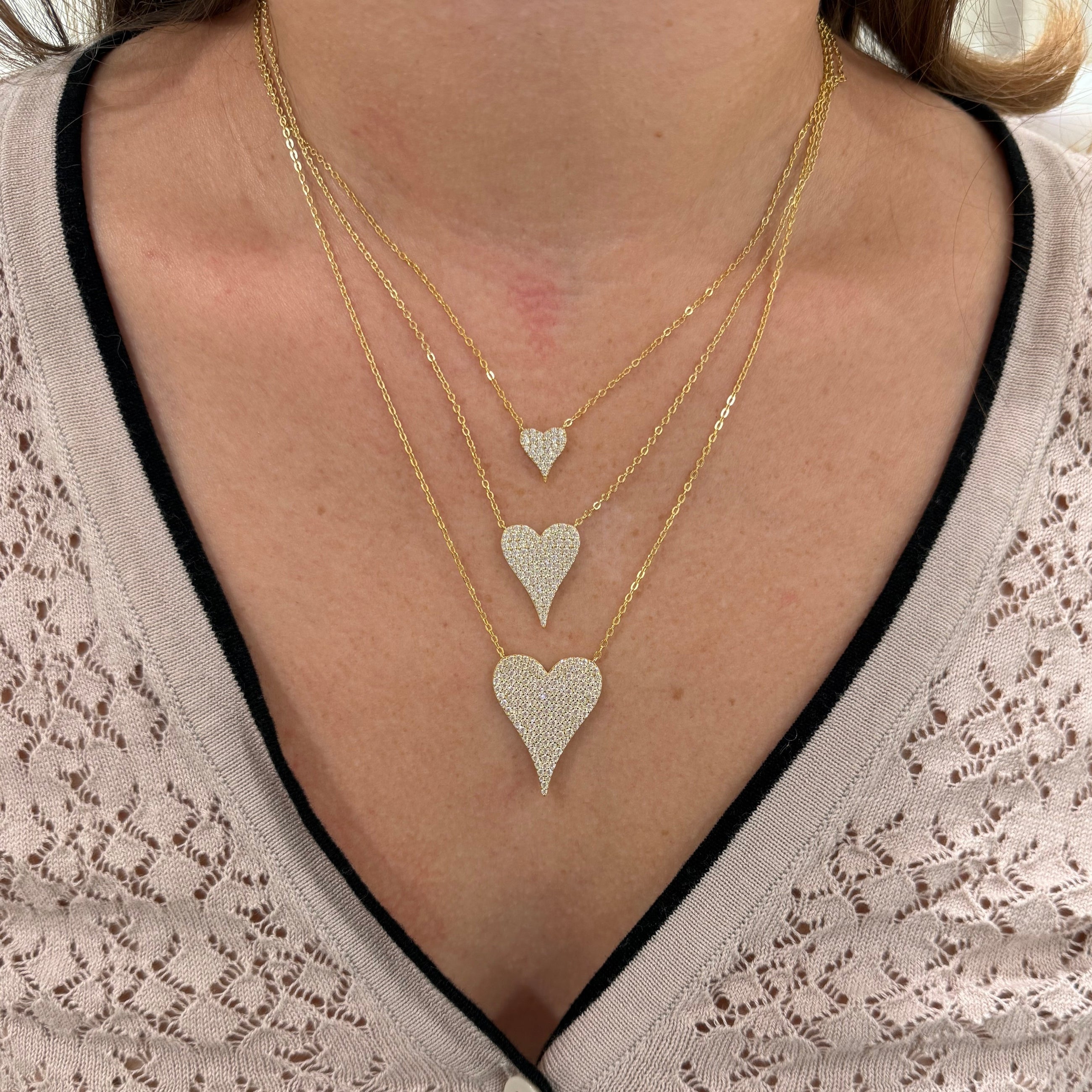 Romantic pave heart necklace layered with chains