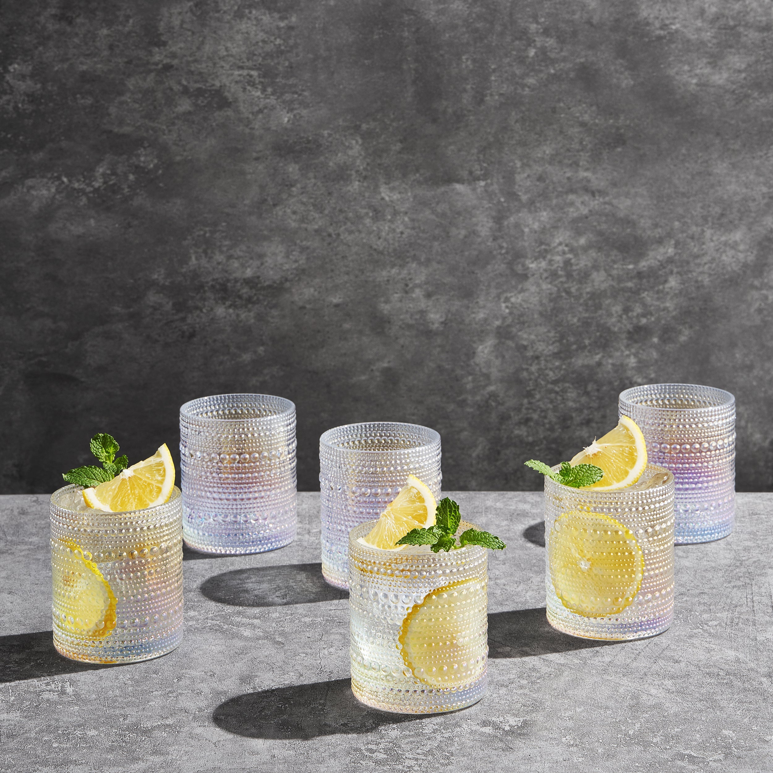 Clear textured cocktail glasses styled in barware collection