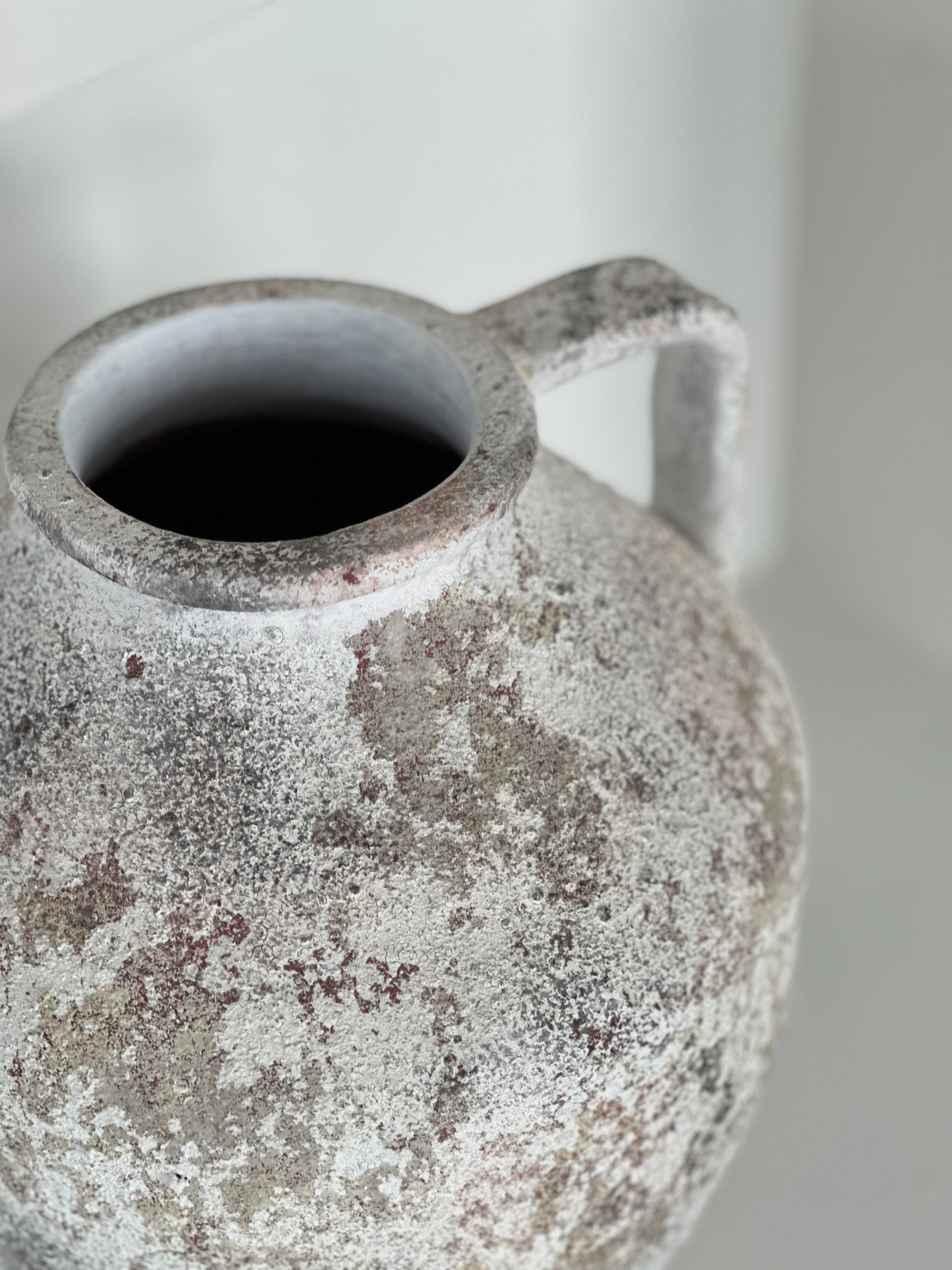 Artisan cream concrete vase styled on table or shelf