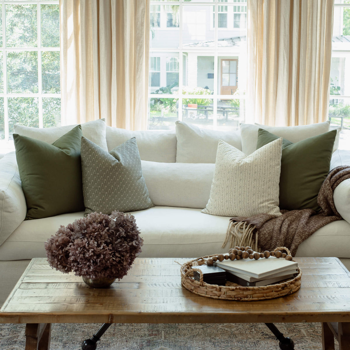 Vivienne sage floral pillow styled in a modern living room