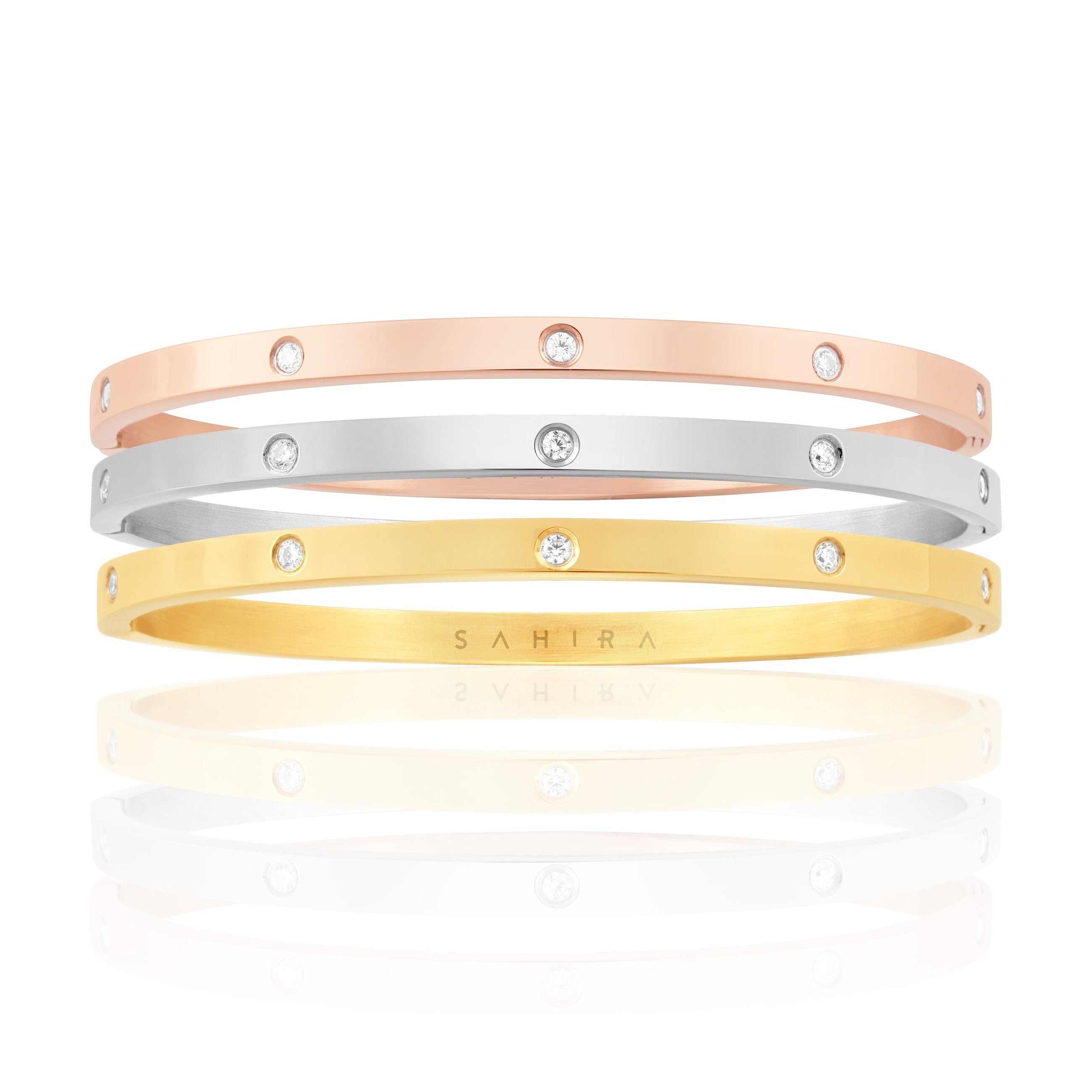 Elsie Trio Stack featuring gold, rose gold, and silver eternity bracelets
