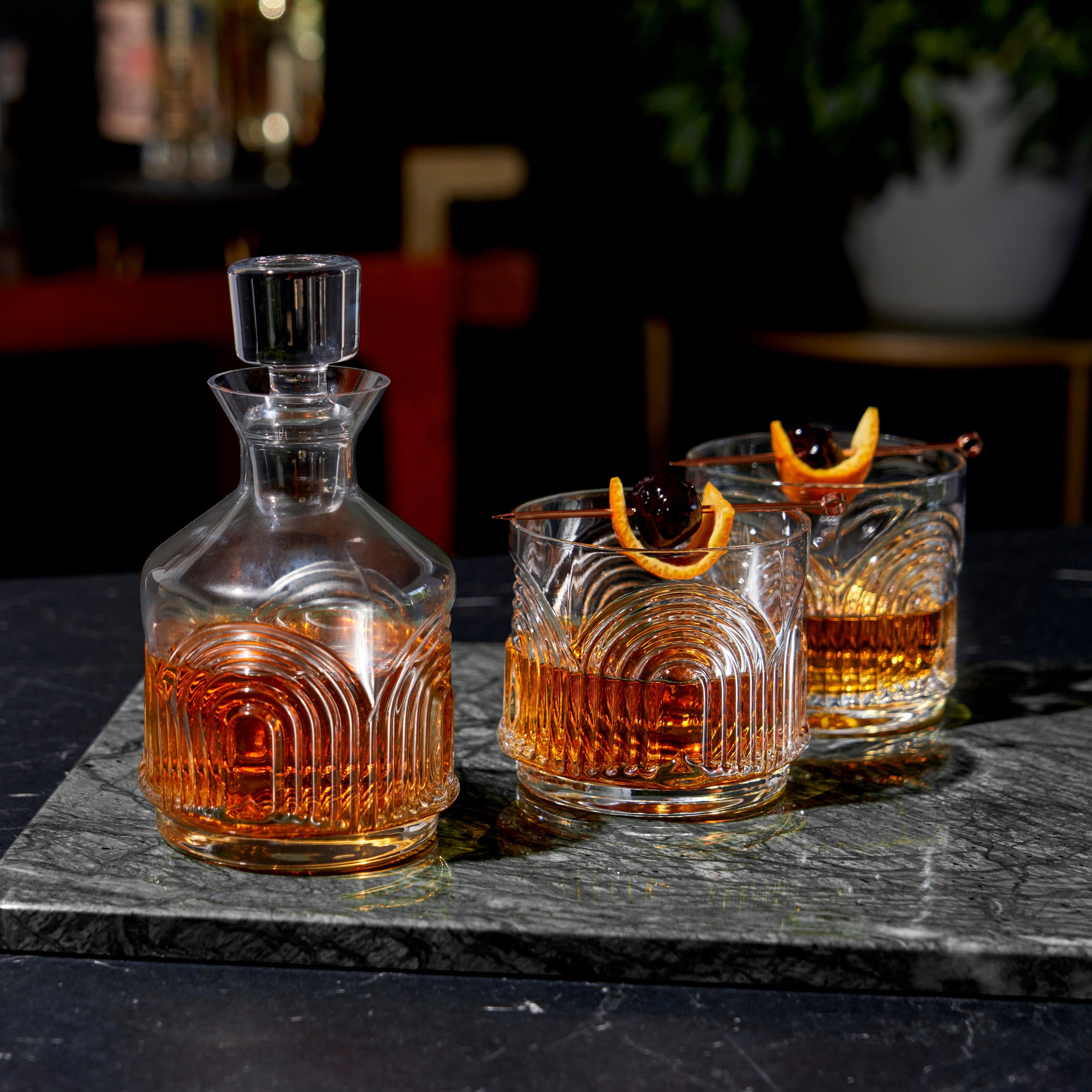 Viski lead-free crystal decanter stacked with matching tumblers
