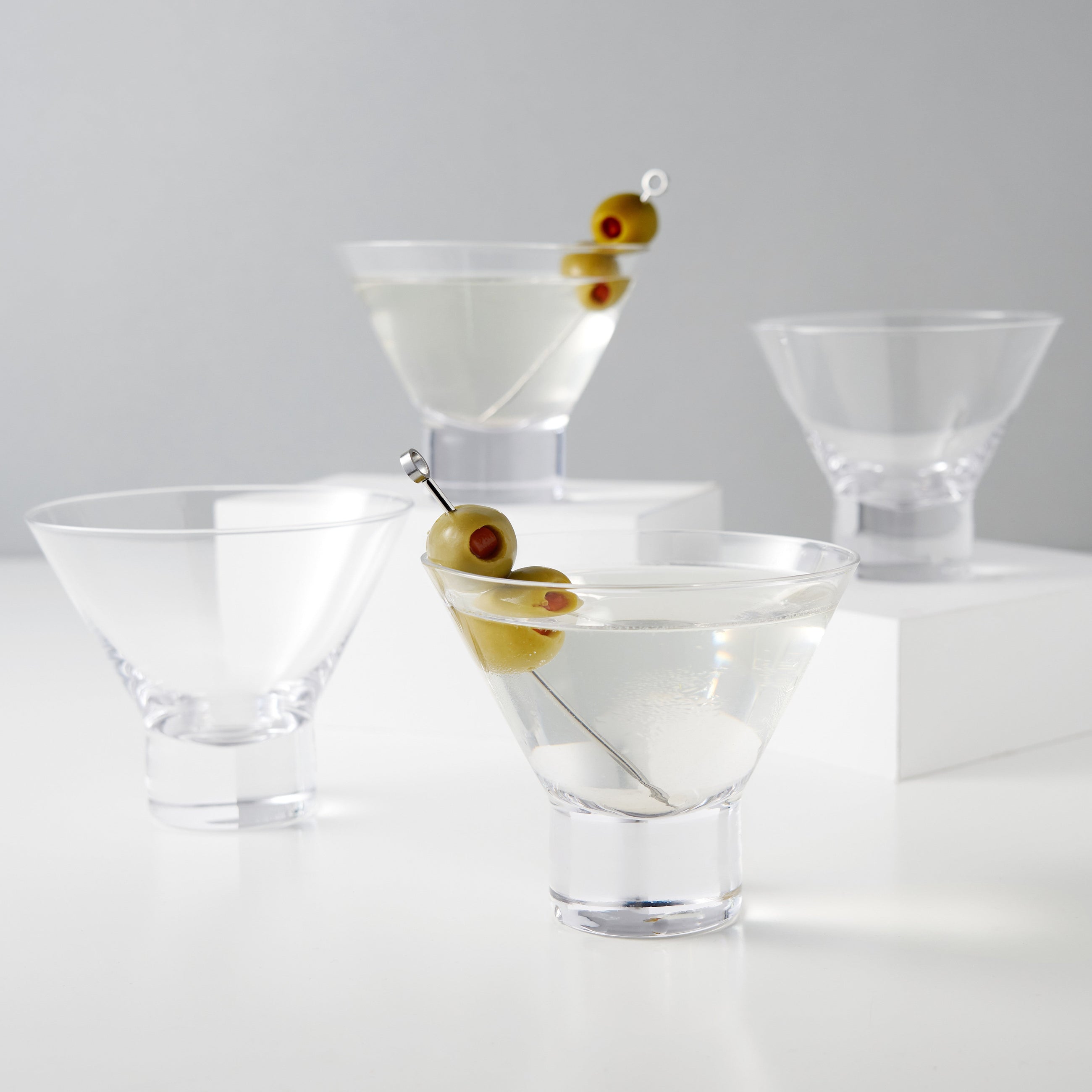 Modern crystal martini glasses styled with citrus garnish