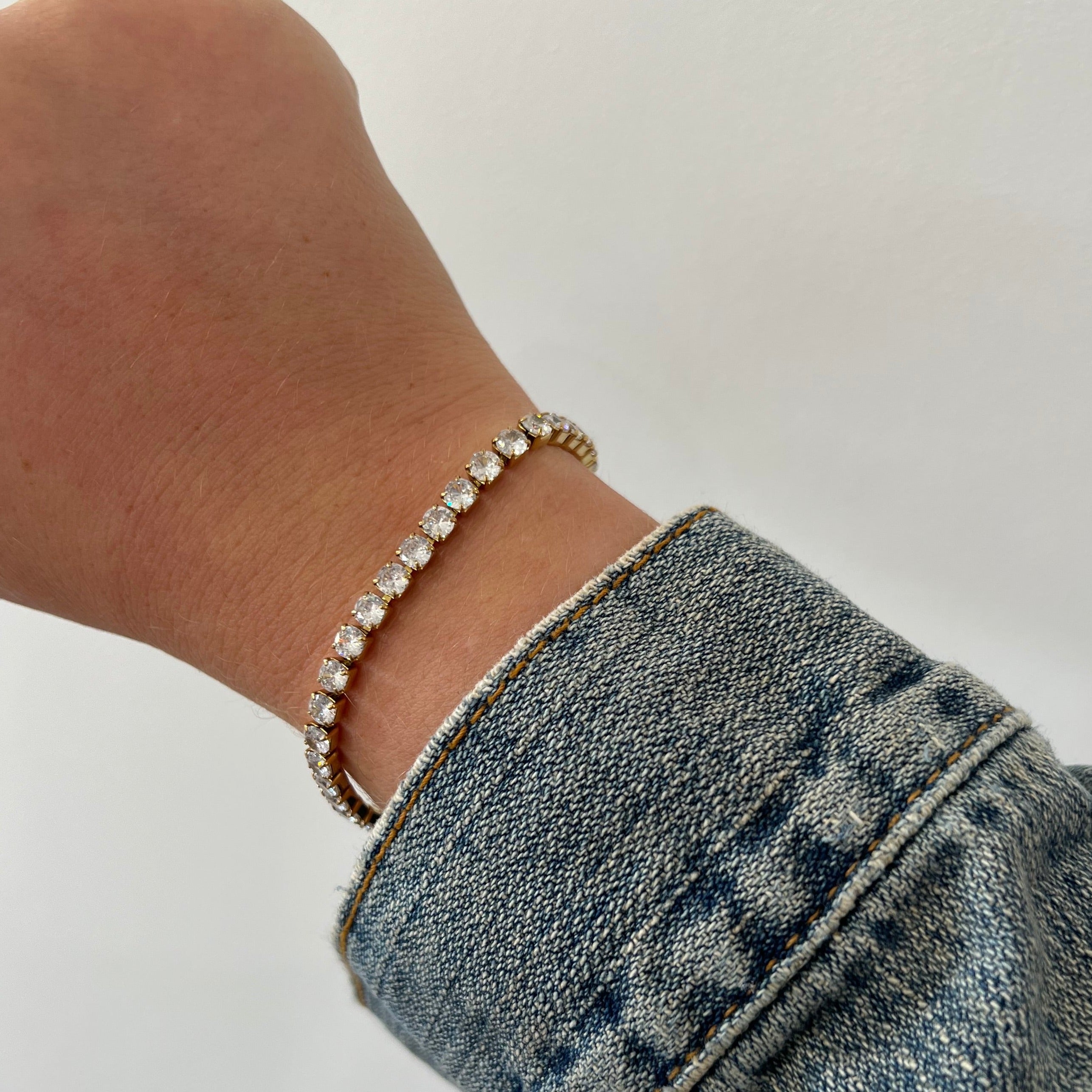 Close-up of Rhae Tennis Bracelet gold-plated links and stones