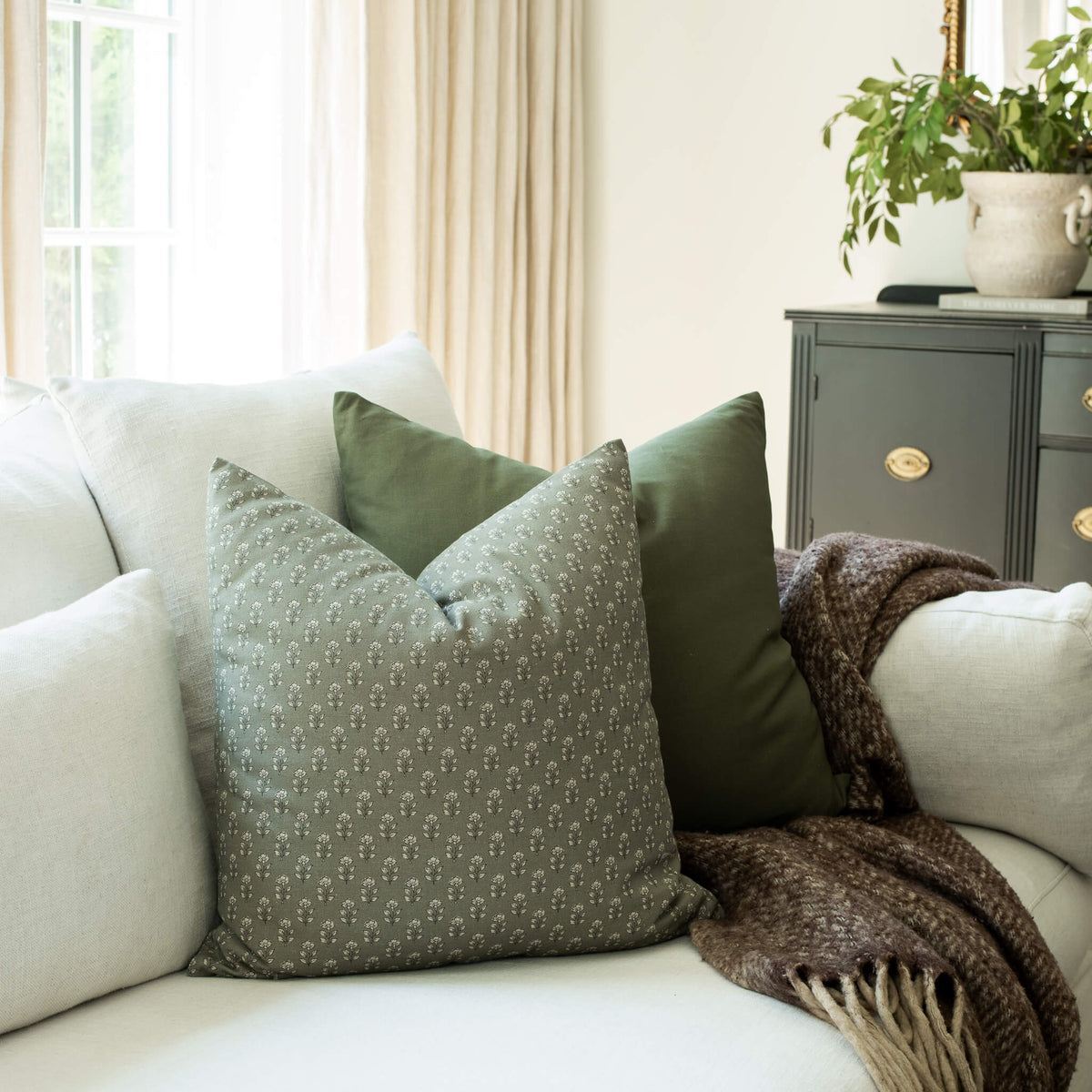 Vivienne sage textured floral throw pillow cover on a sofa