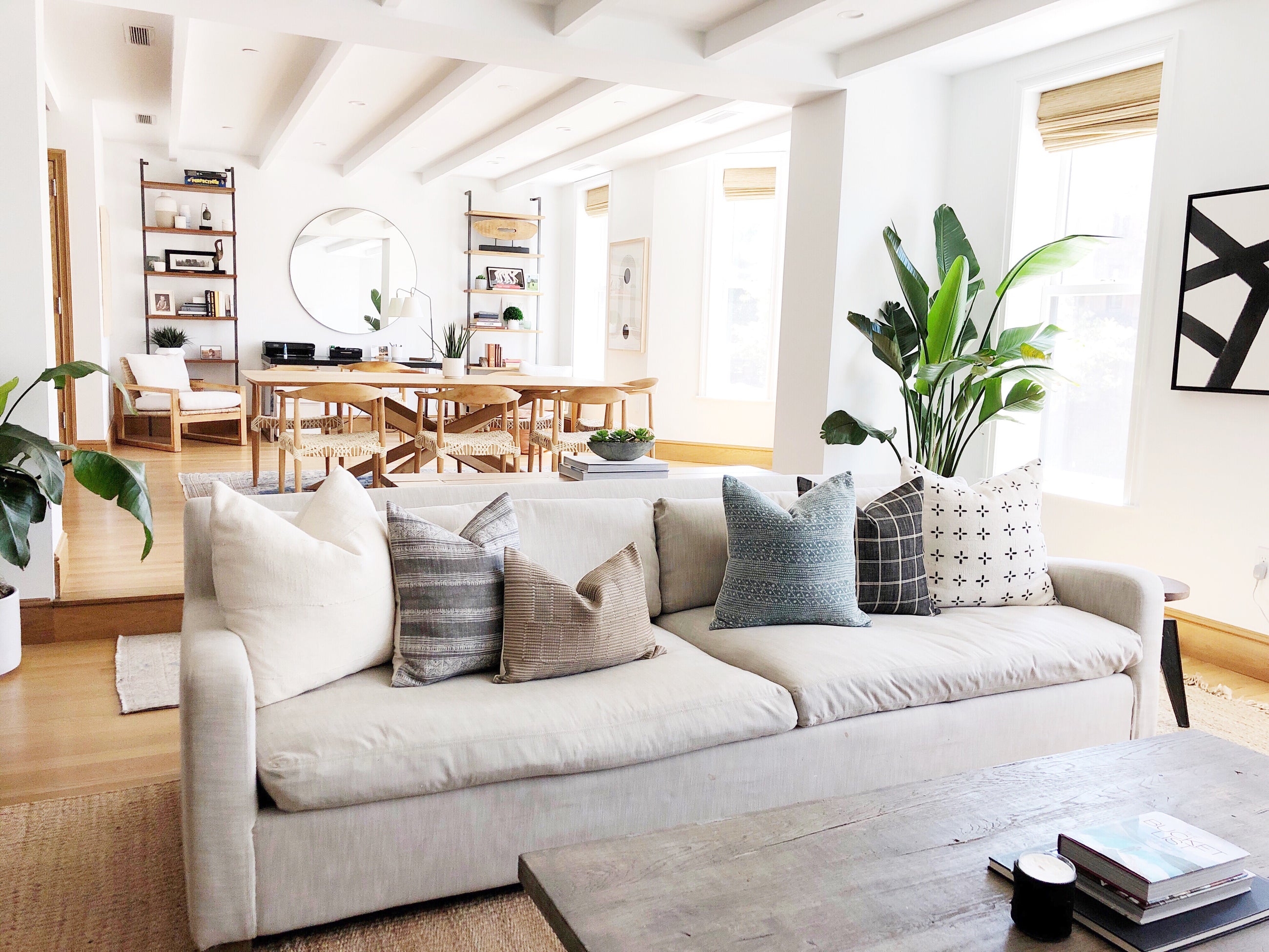 Modern living room with a grey couch with throw pillows on it