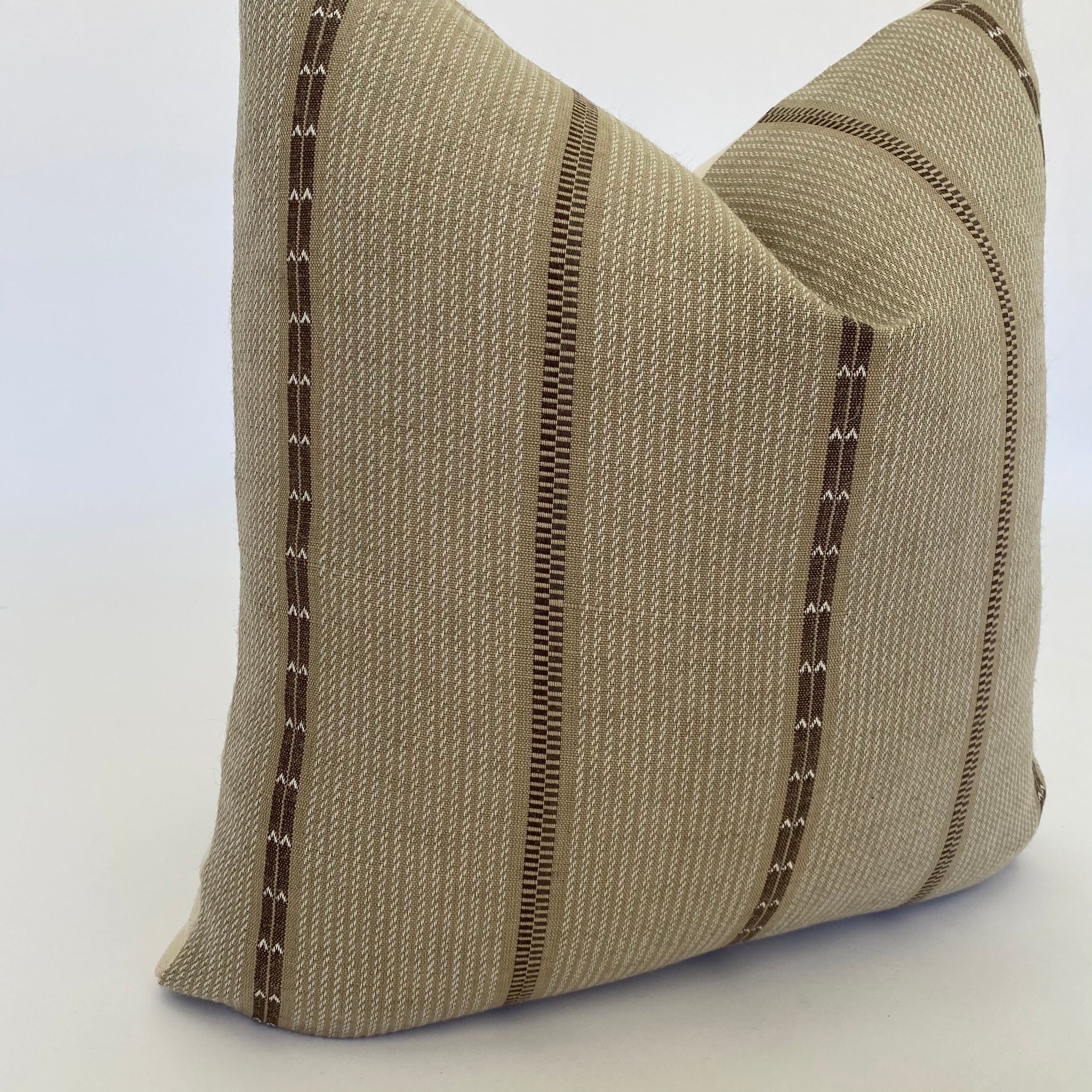 a brown pillow smiling or the camera