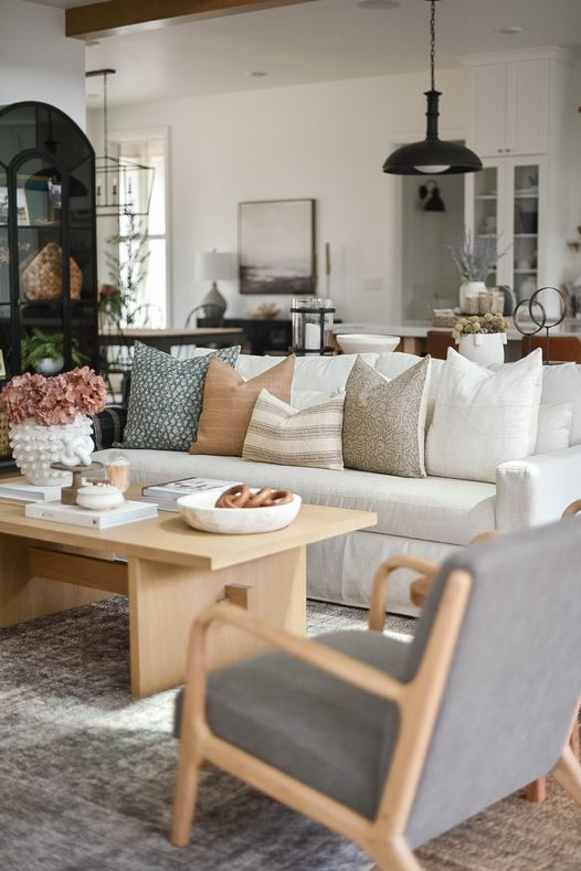 vintage pillows on white couch in living room