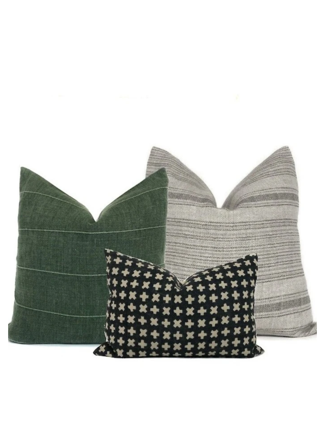 Three throw pillows on a white background