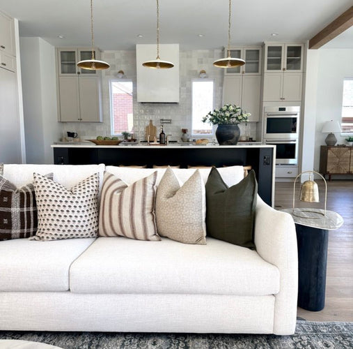 Classy Living Room with Throw Pillows on a White Couch