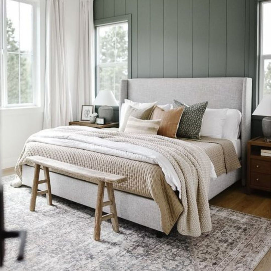 bedroom with cream colored bedding