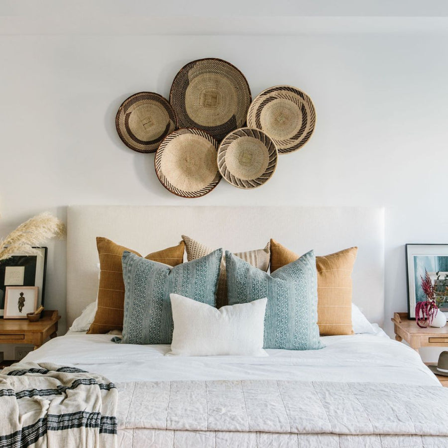 5 layered pillows on a king bed