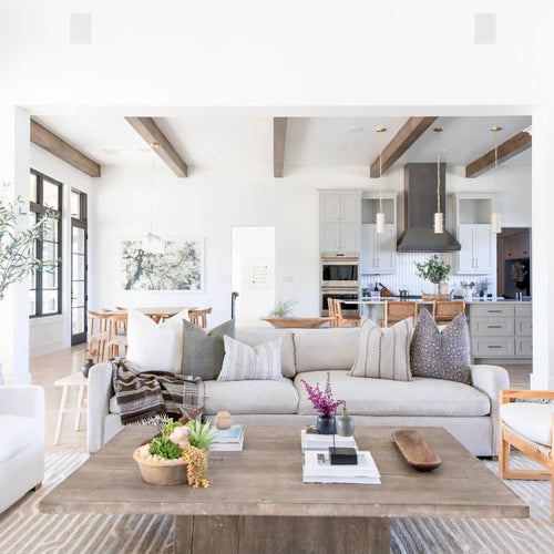Living space with a couch and various throw pillows on the couch