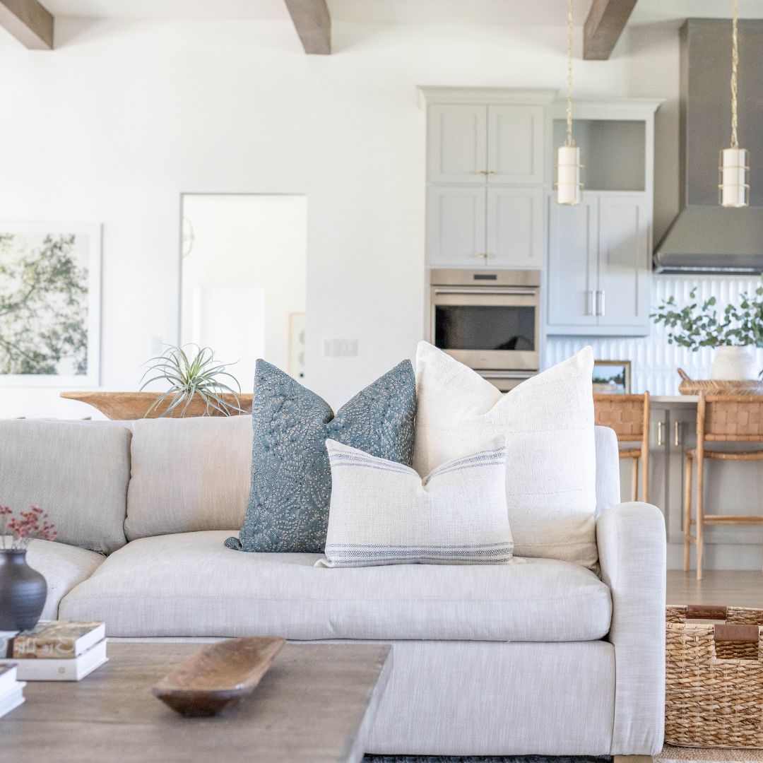 Grey couch with throw pillows