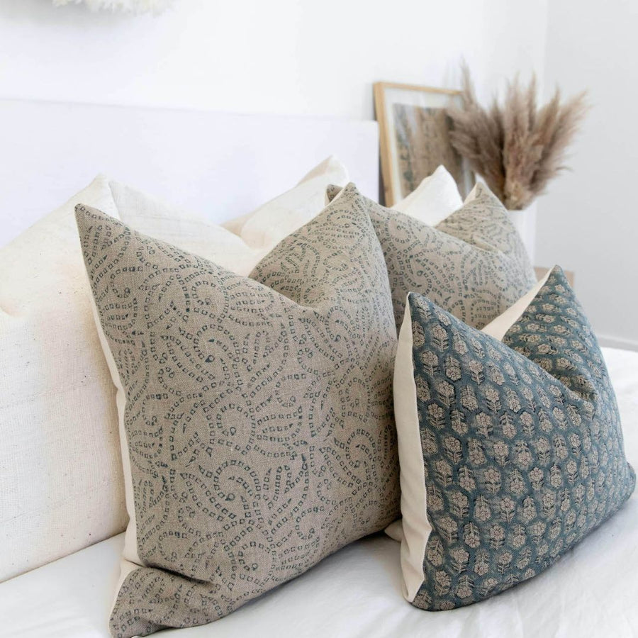 Pillow set resting on a bed
