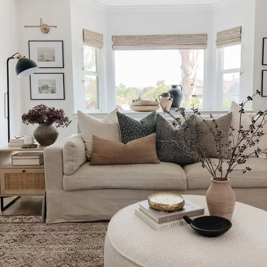 rustic pillows on tan couch