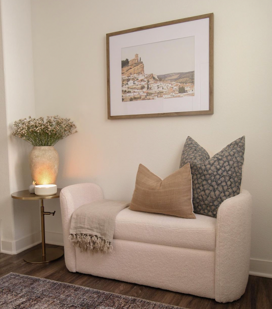 white couch in hallway with gray and tan throw pillow
