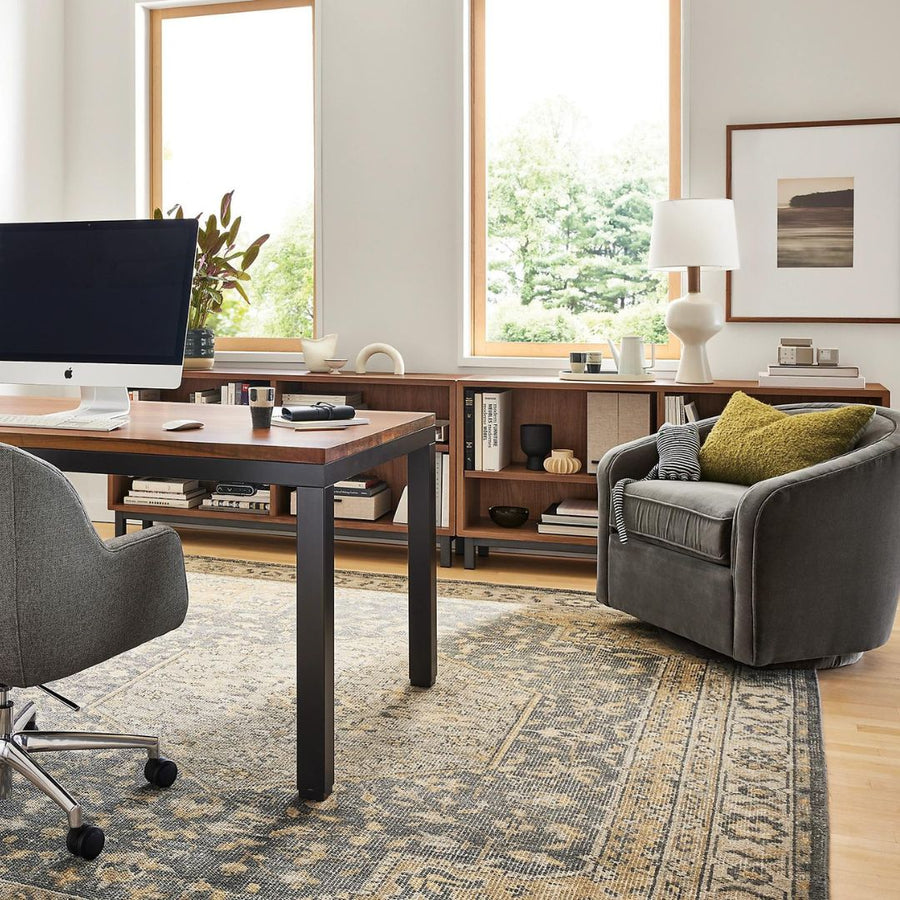 home office with grey chair and yellow pillow