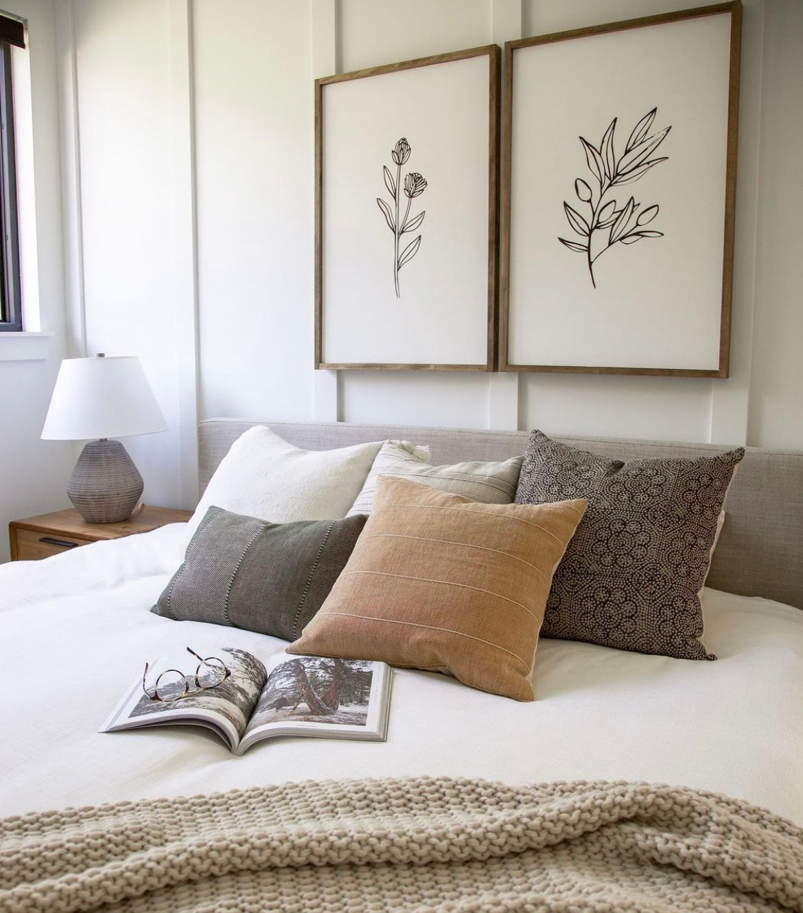 fall pillows on white bed 