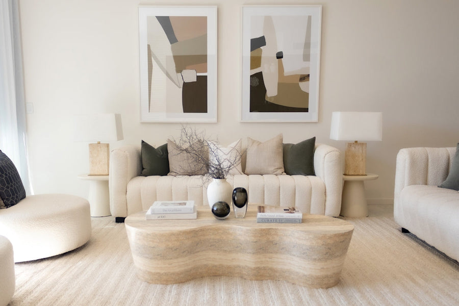 Elegant living room with neutral colors and art.