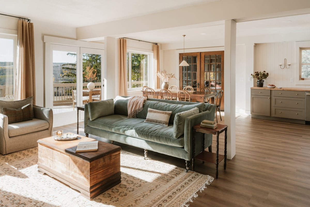 Cozy living room with plush sofa and wooden chest.