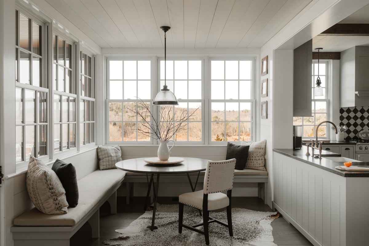 Cozy breakfast nook with built-in seating and dining table.