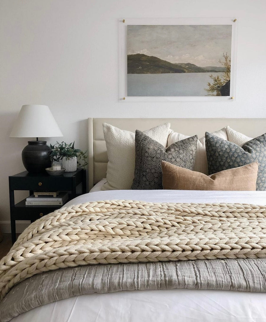 tan wool blankets on white bed