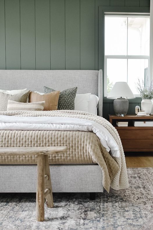 decorative rug in neutral bedroom with bed and pillows