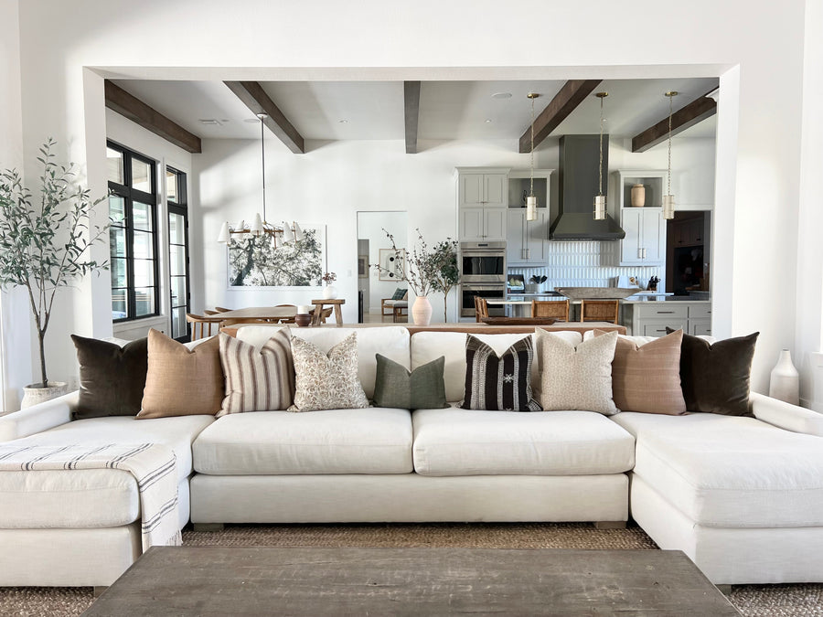 Designer pillow covers styled on a sofa - best sellers