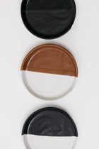 Black and white stoneware spoon rest for cooking