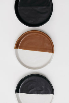 Black and white stoneware spoon rest for cooking