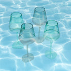 Tall slender beige wine goblet styled poolside