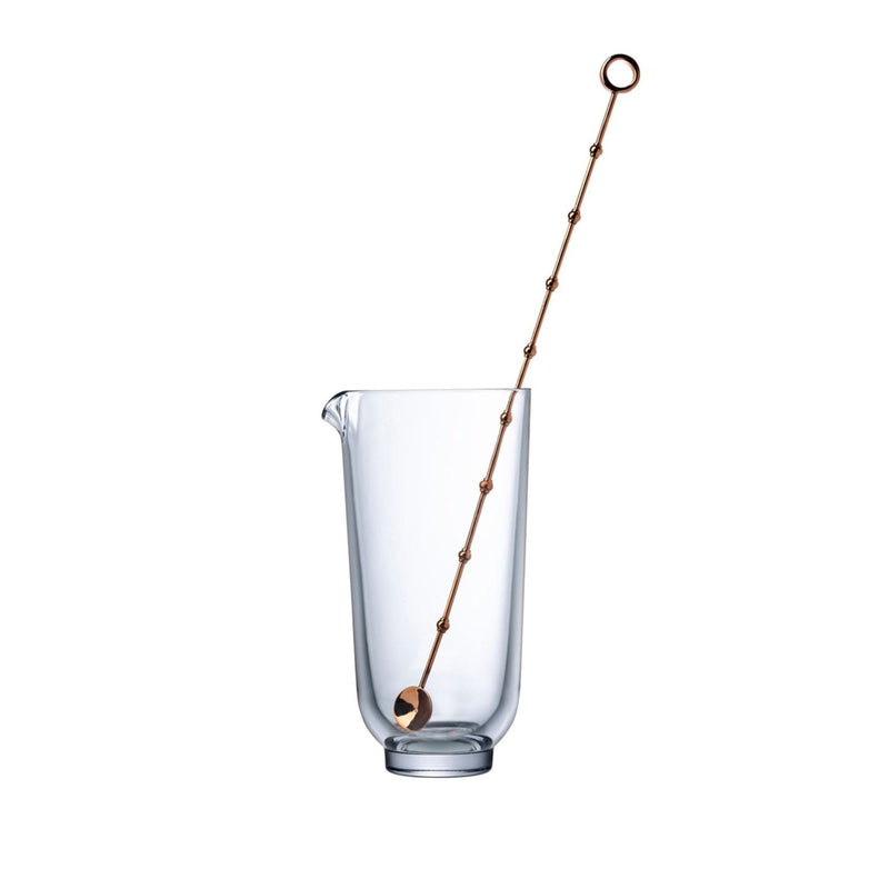 Elegant crystalline glass mixing vessel with copper stirrer