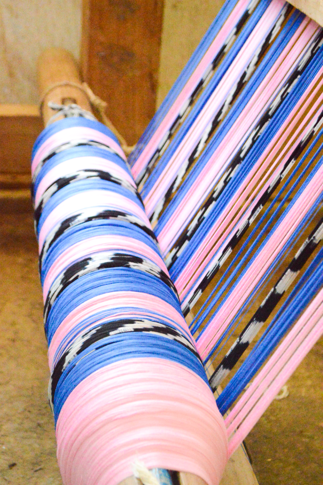 Palm ikat blanket in blue and pink, styled