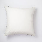 Back of the checkered brocade pillow in green and cream