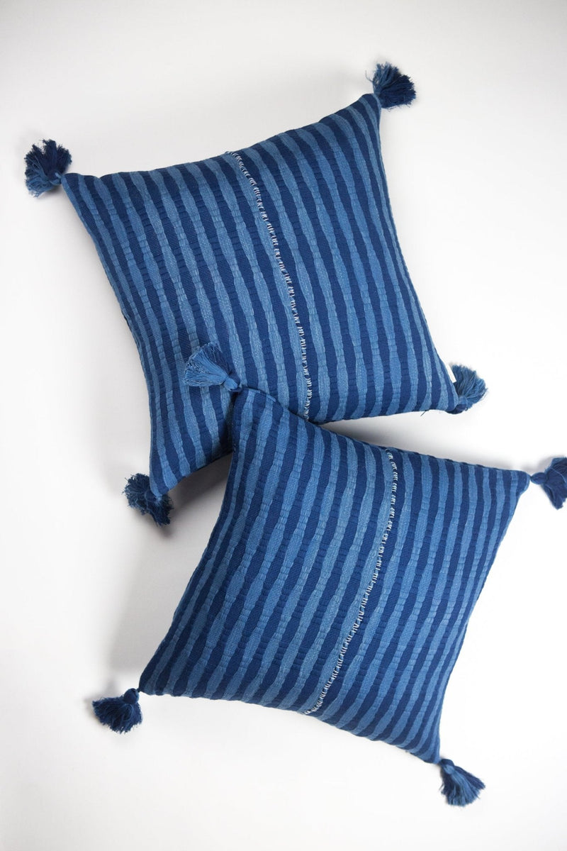 Pair of 20x20 Antigua pillows in natural indigo stripe