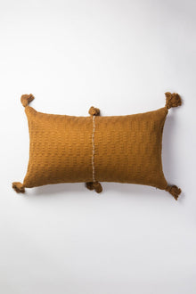 Front of the 12x20 Antigua lumbar pillow in solid umber brown