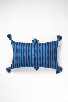 Front of the 12x20 Antigua lumbar pillow in natural indigo stripe