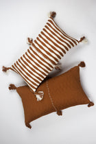 Pair of 12x20 Antigua lumbar pillows in umber brown