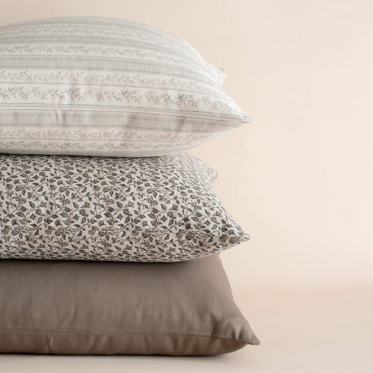 Blue and neutral pillow set featuring the Camille pillow