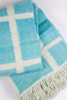 Momos Grid felted wool blanket in aqua blue and natural white, detail