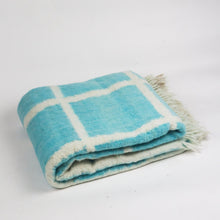Momos Grid felted wool blanket in aqua blue and natural white