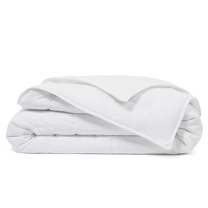 Luxury down alternative comforter on neatly made bed