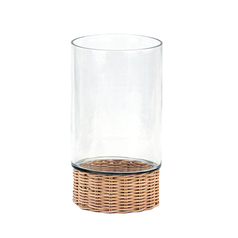 Handcrafted clear glass and rattan candleholder on table
