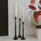 Minimalist matte black candle holders styled with tapers