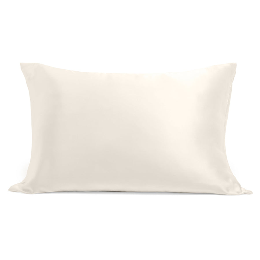 100% silk pillowcase in soft neutral tone styled on bed